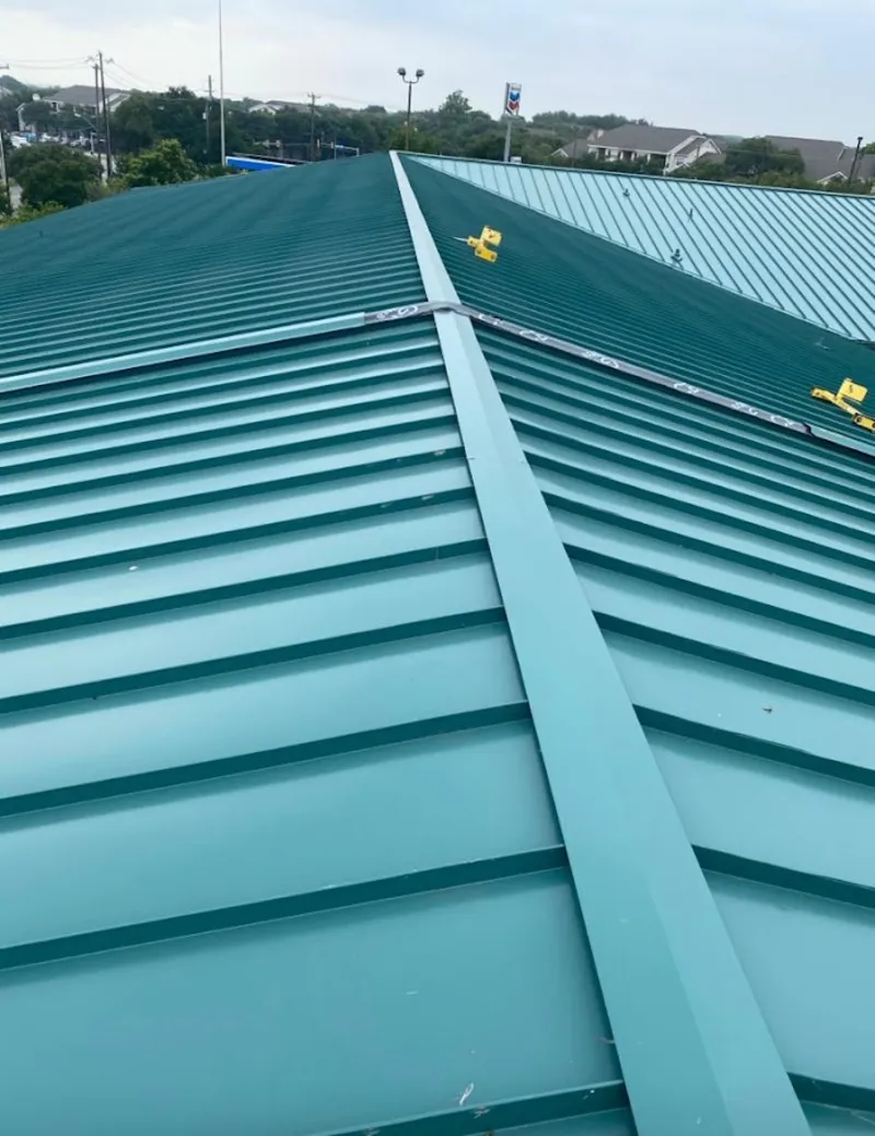 Green commercial metal roof ridge and valley for Metal Roof Repair in Aurora